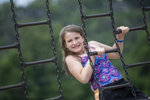 Girl on playground equipment 